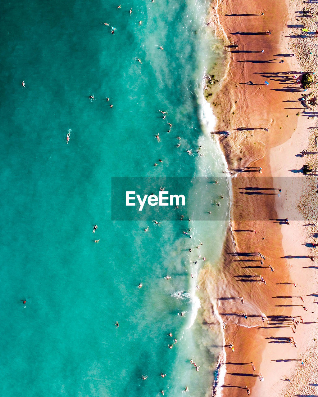 High angle view of people enjoying at beach