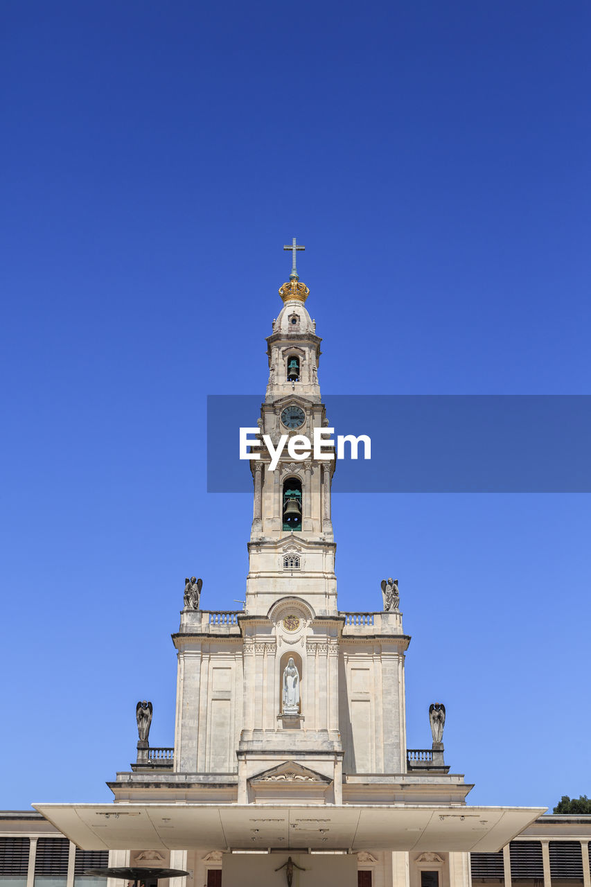 low angle view of historic building against clear blue sky