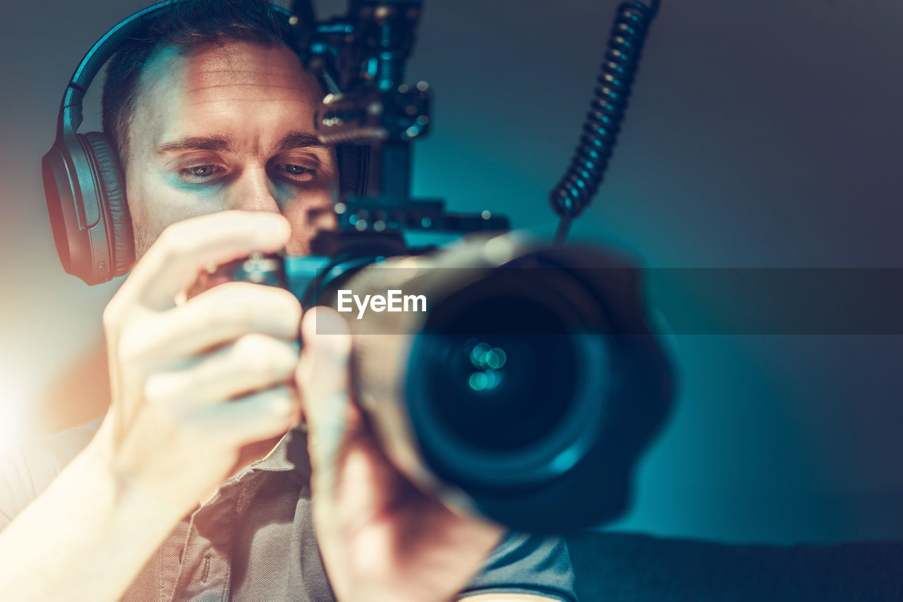 Close-up of man holding camera