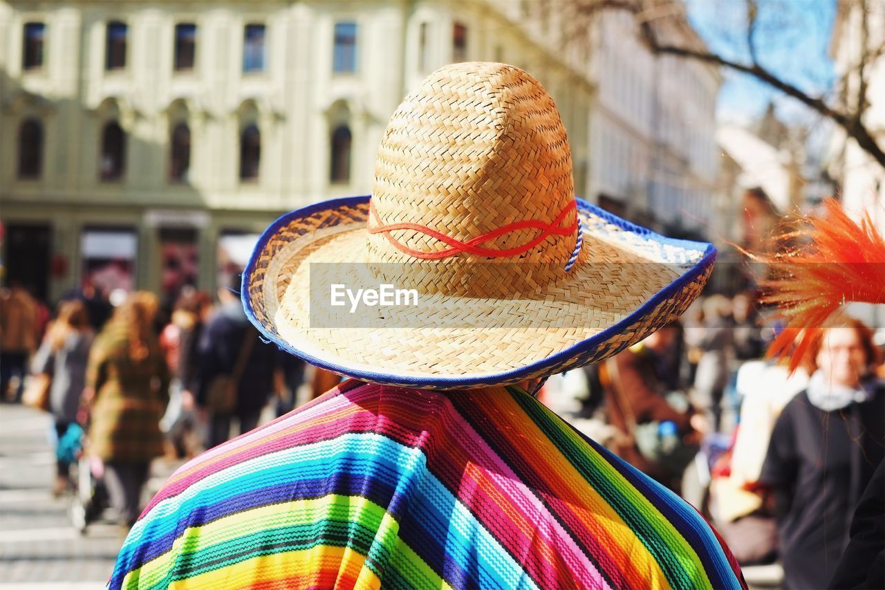 Rear view of person with poncho and sombrero