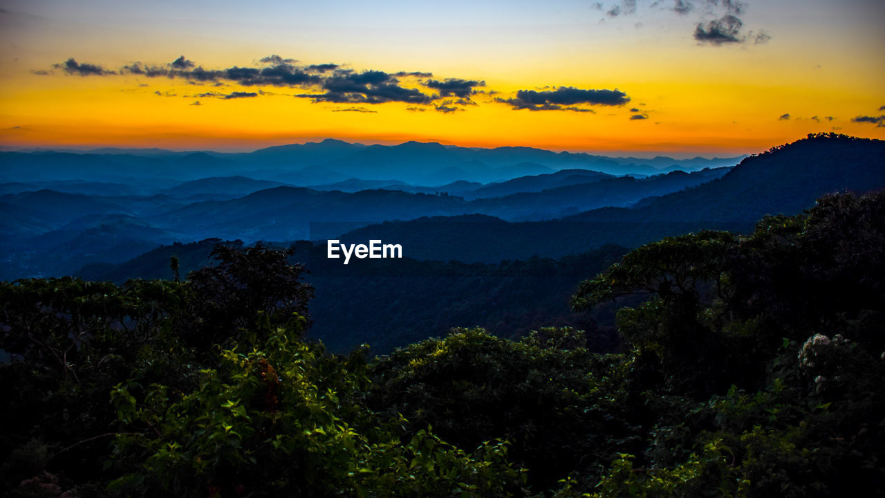 Scenic view of mountains at sunset
