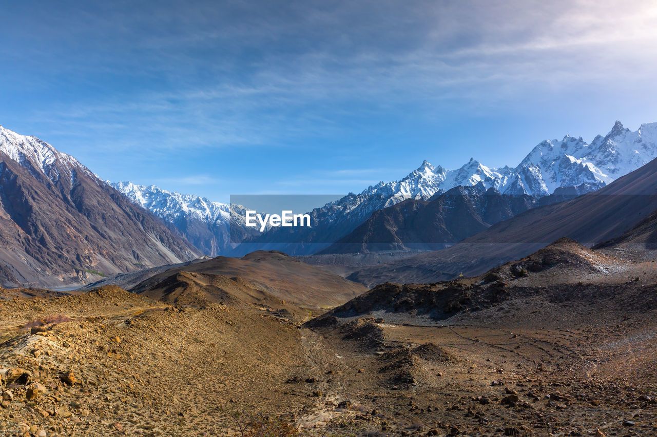 Scenic view of snowcapped mountains against sky