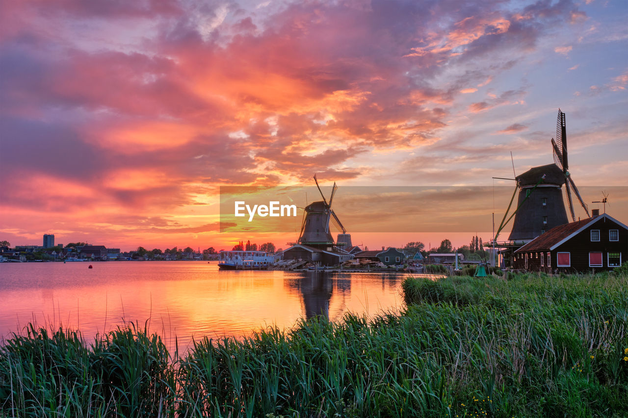 Windmills at zaanse schans in holland on sunset. zaandam, nether