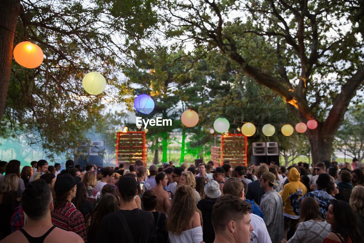 GROUP OF PEOPLE AT MUSIC FESTIVAL