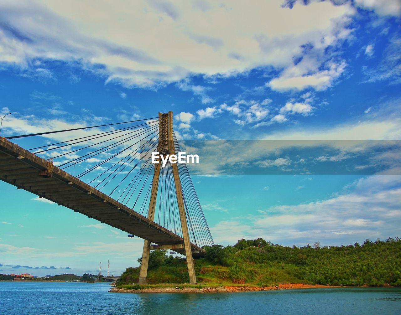 VIEW OF BRIDGE OVER RIVER AGAINST SKY