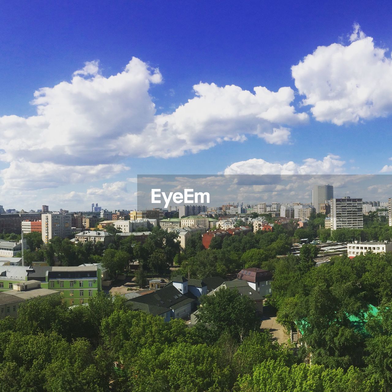 High angle view of city against cloudy sky