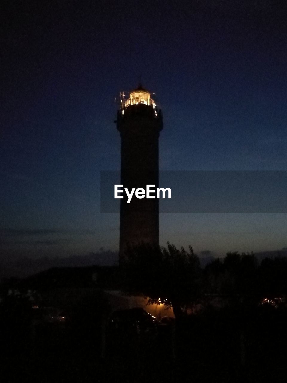 SILHOUETTE LIGHTHOUSE AGAINST SKY AT NIGHT