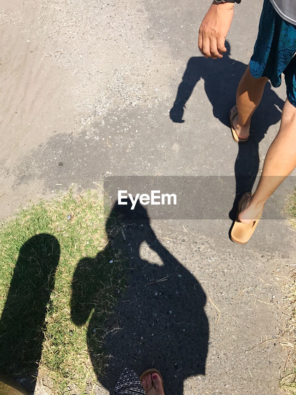 HIGH ANGLE VIEW OF PEOPLE WALKING ON STREET