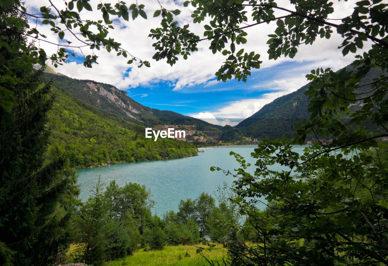 Scenic view of lake and mountains against sky