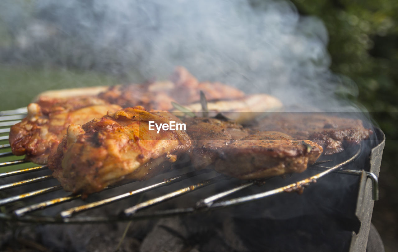 Close-up of meat on barbecue grill