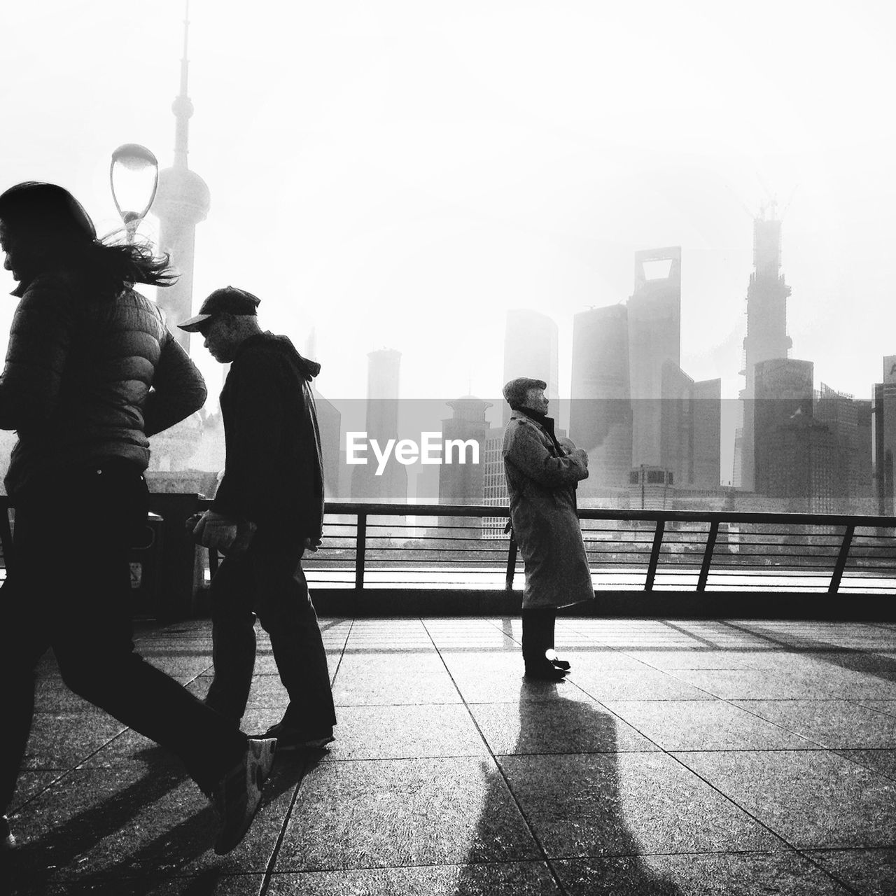 WOMAN WALKING ON CITY STREET