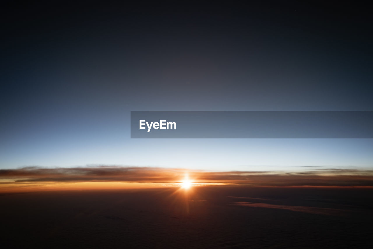 low angle view of clouds in sky at sunset