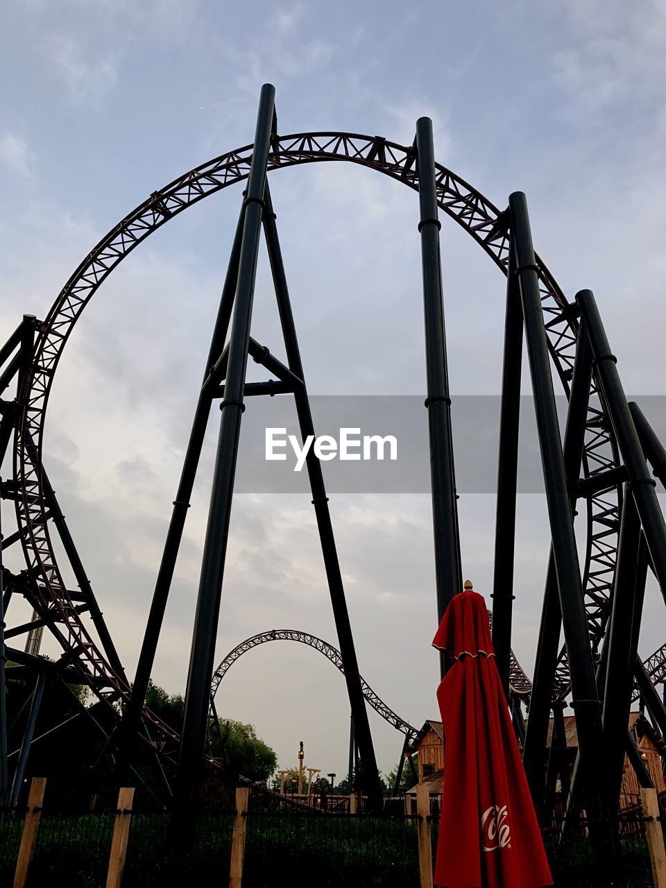 LOW ANGLE VIEW OF AMUSEMENT PARK RIDE AGAINST SKY