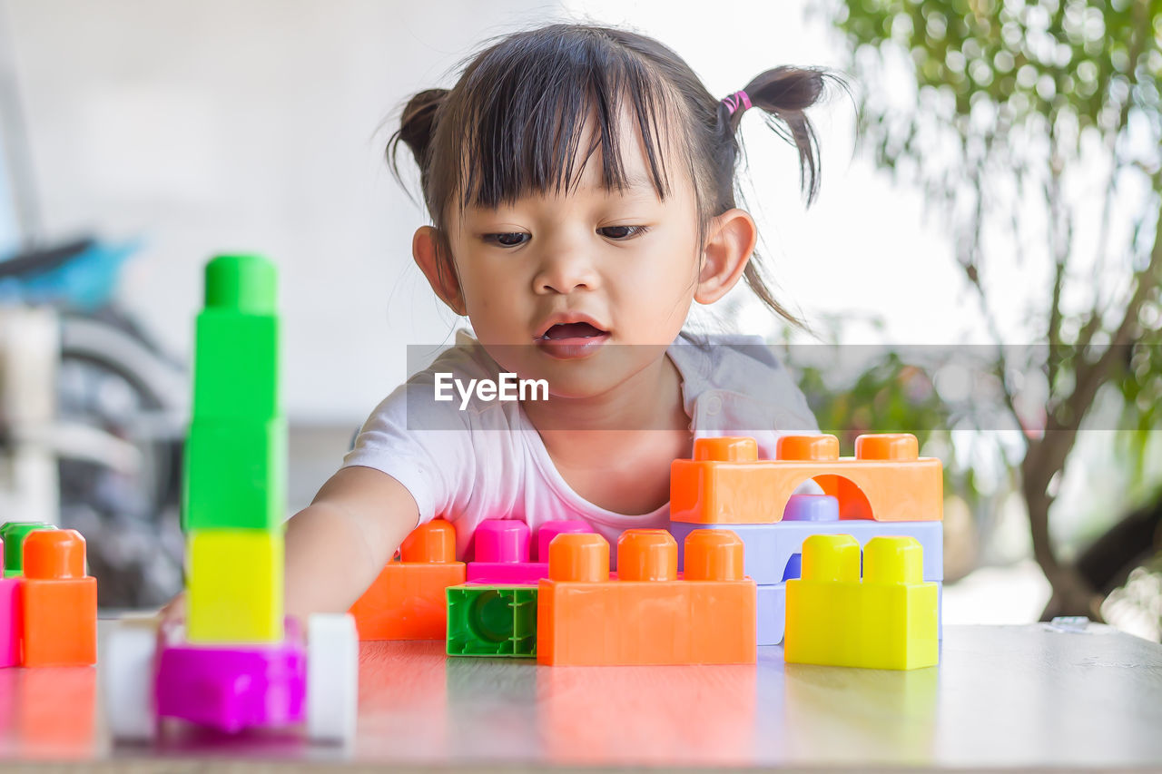 Cute girl playing with toy