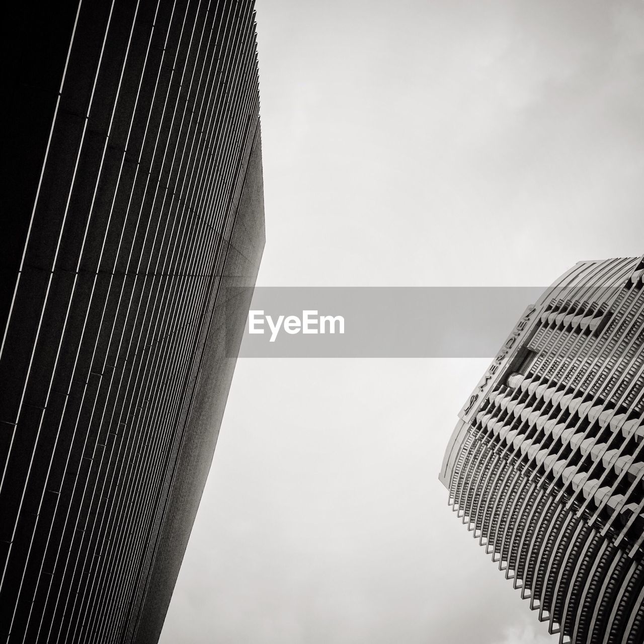 Low angle view of tall buildings against clear sky