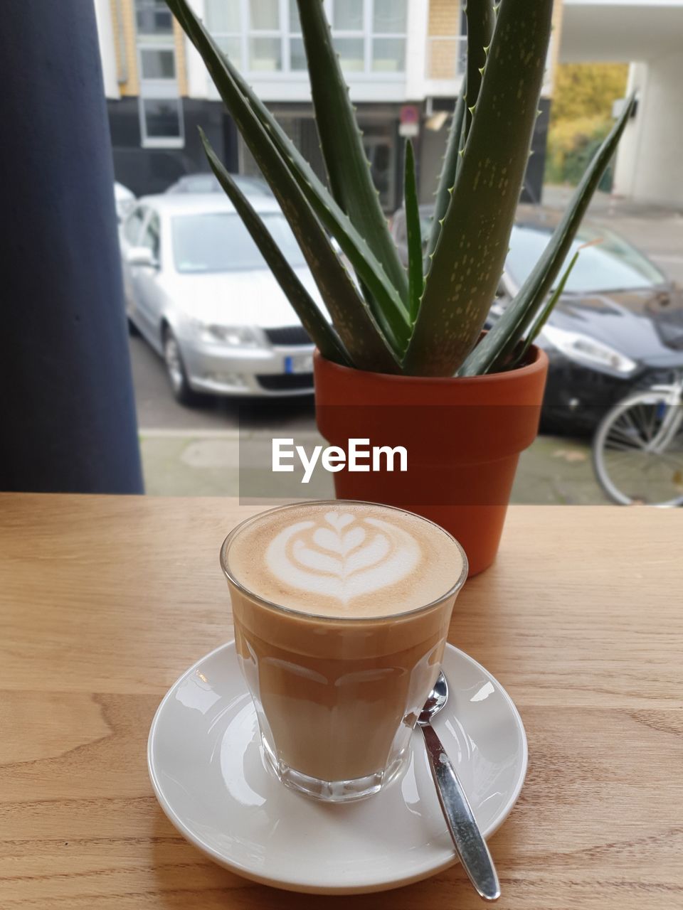 CLOSE-UP OF COFFEE SERVED ON TABLE IN CAFE