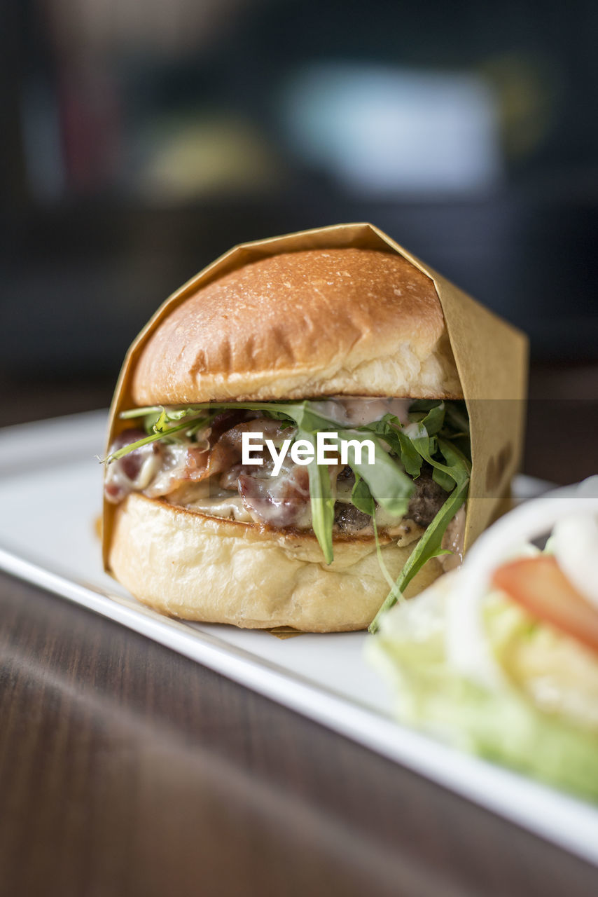 Burger in plate on table