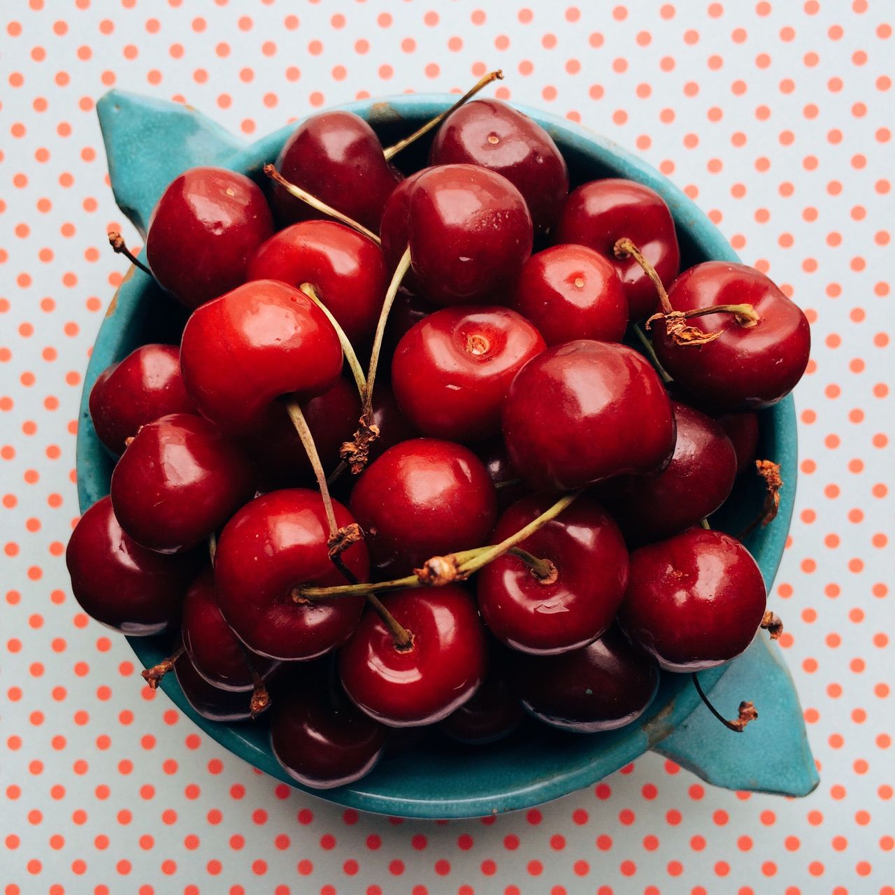 Overhead view of cherries in bowl