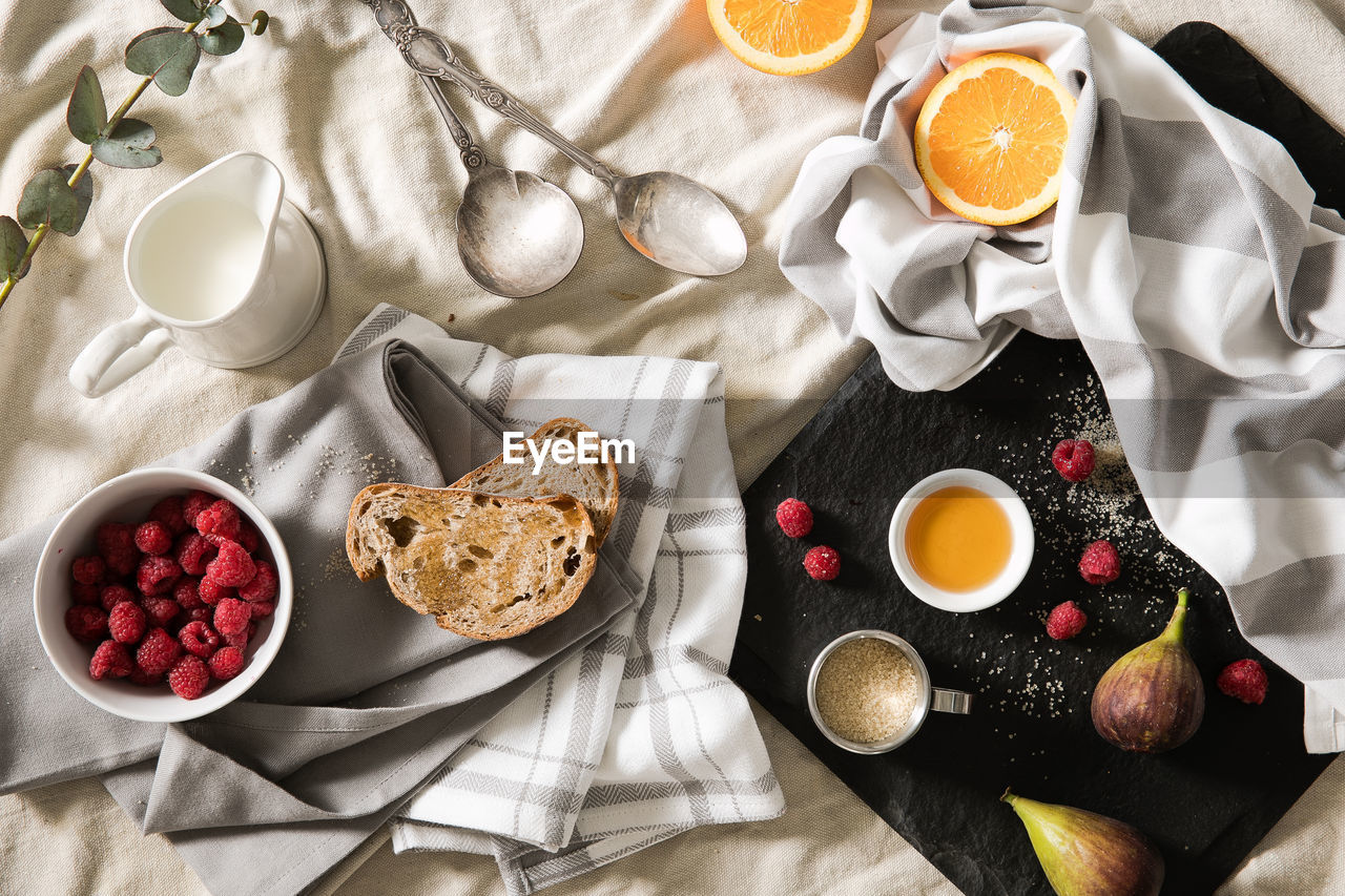 High angle view of breakfast on fabric