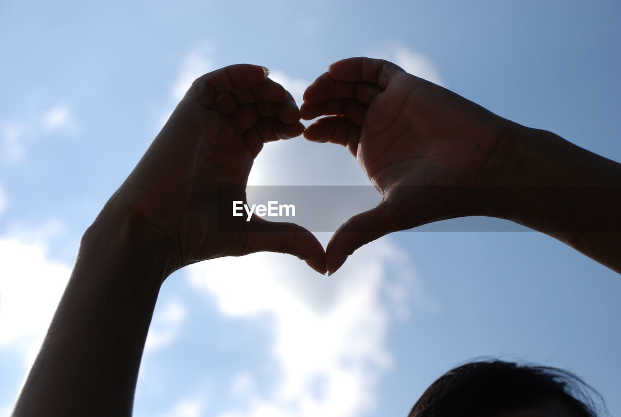 LOW ANGLE VIEW OF HEART SHAPE AGAINST THE SKY