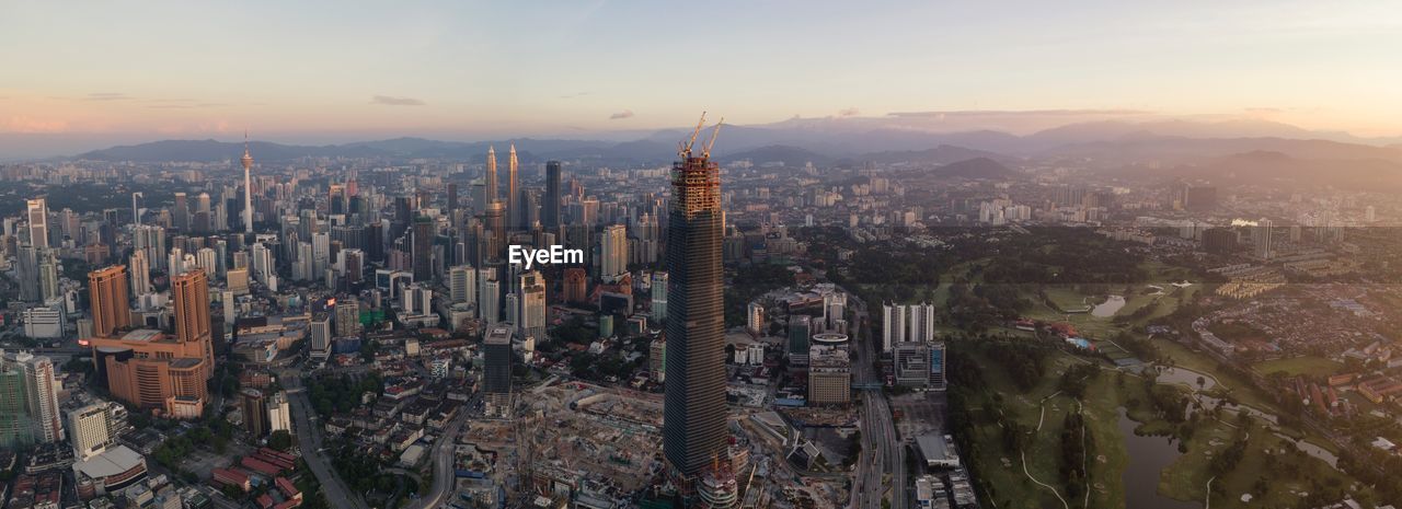 Aerial view of city at sunset