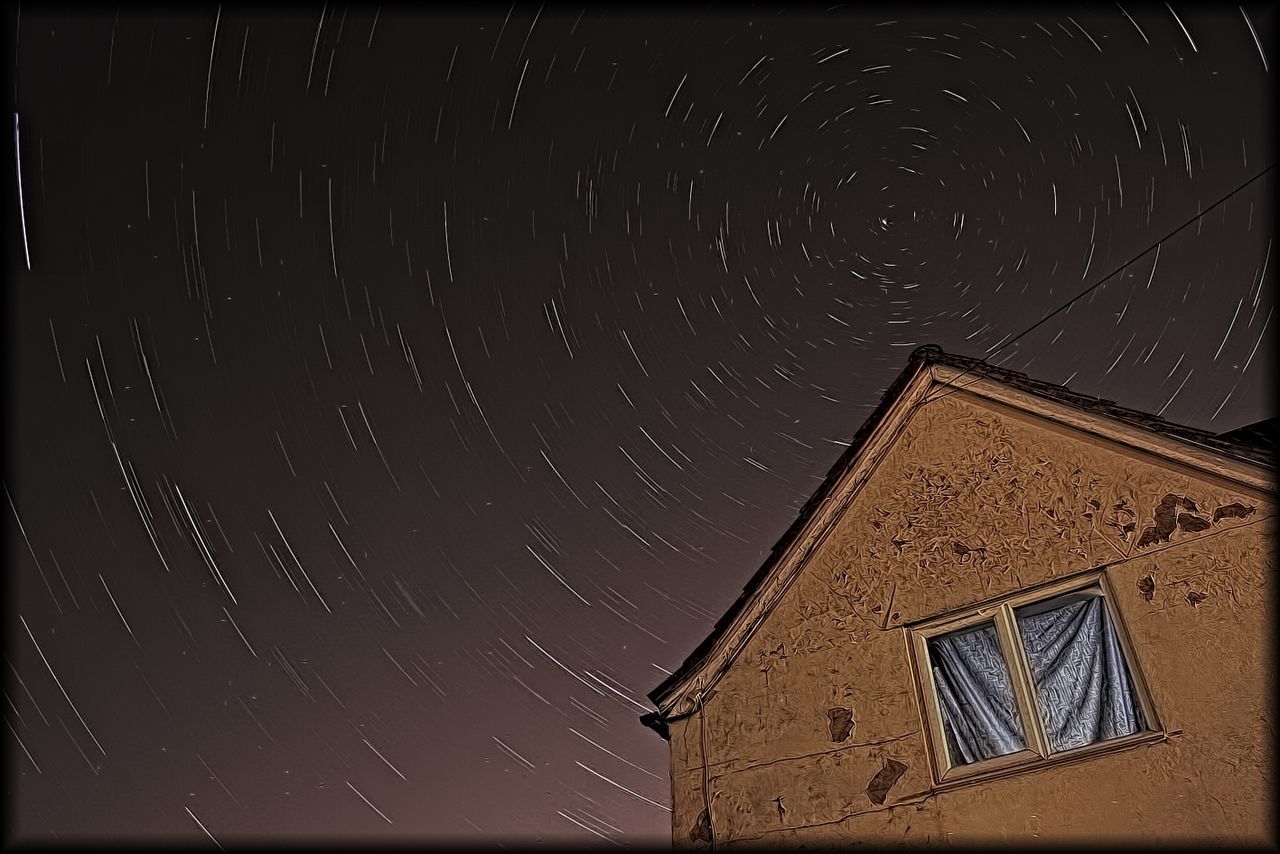 Low-angle view of house at night