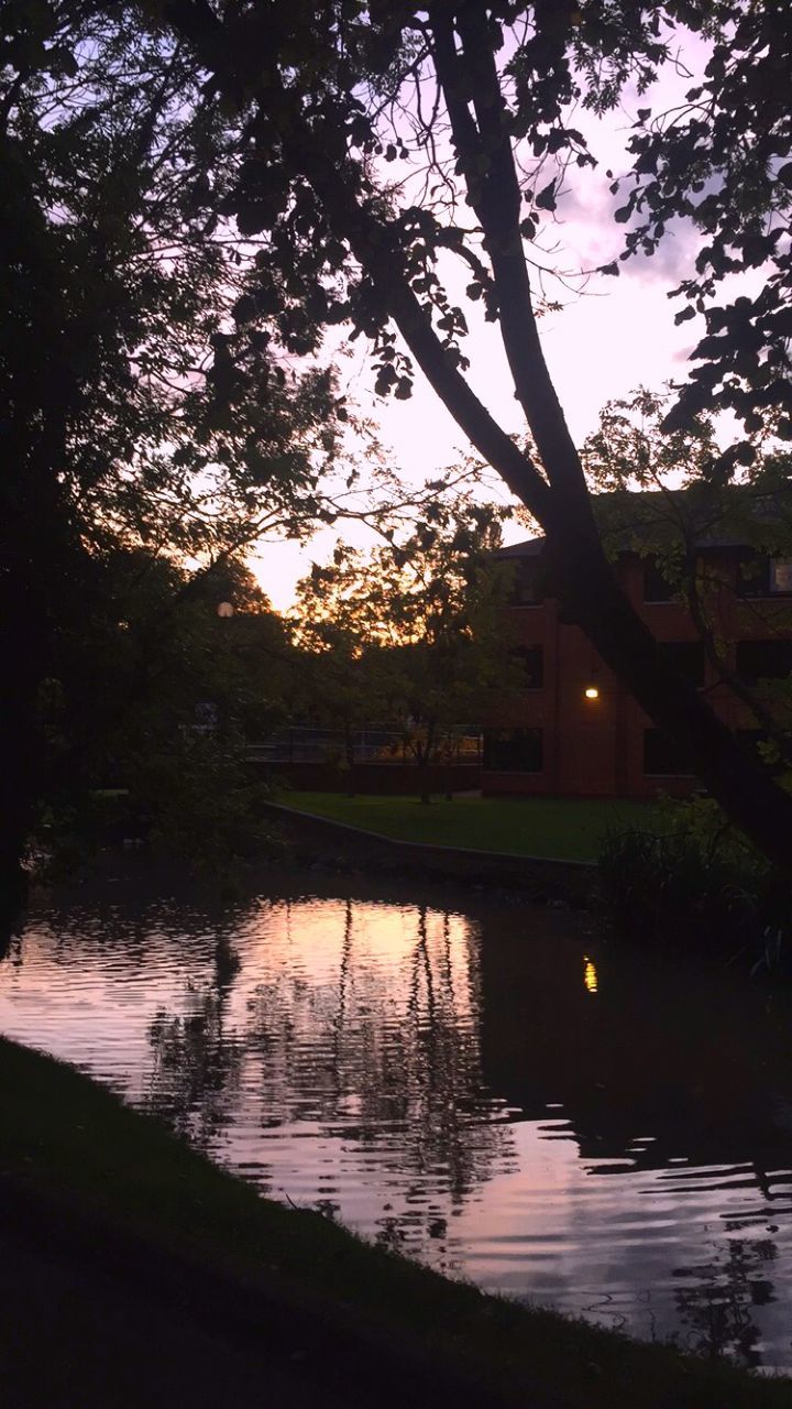 SCENIC VIEW OF LAKE AT SUNSET
