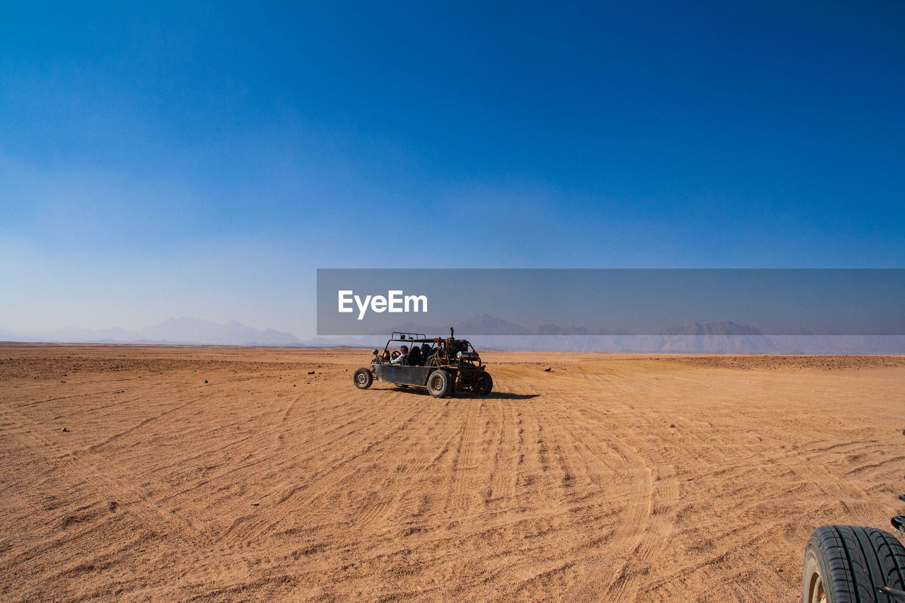 SCENIC VIEW OF DESERT AGAINST CLEAR SKY