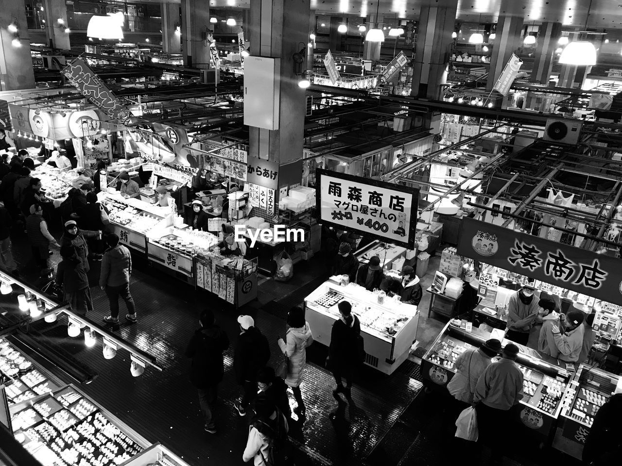 High angle view of people in market at night