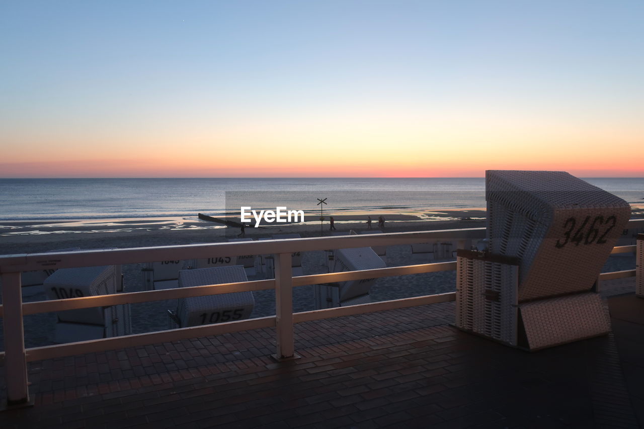 Scenic view of sea against clear sky during sunset, sylt