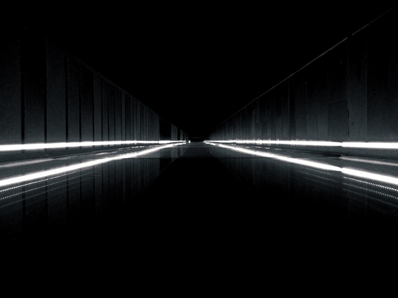 Surface level view of illuminated footbridge