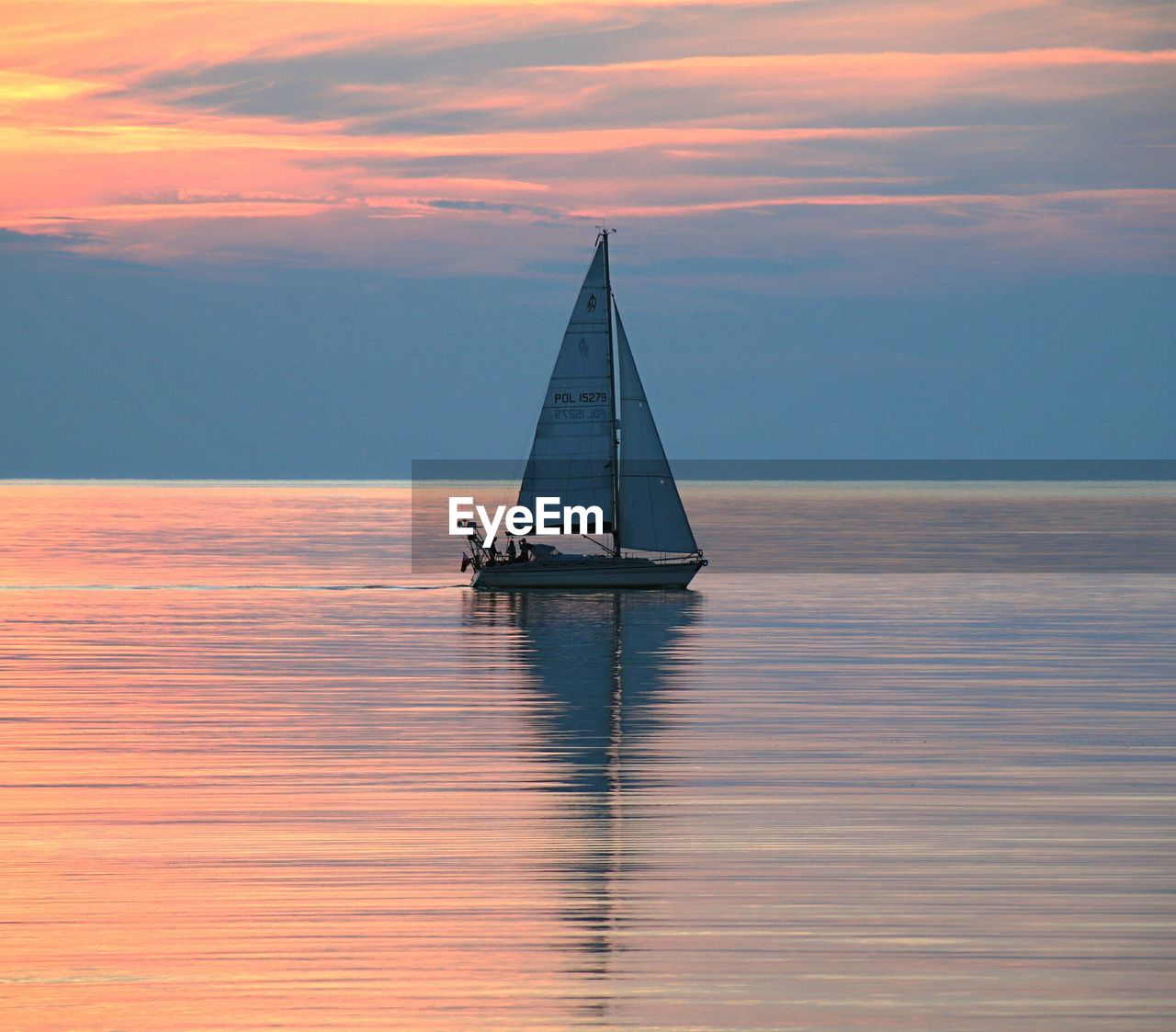 Scenic view of calm sea at sunset