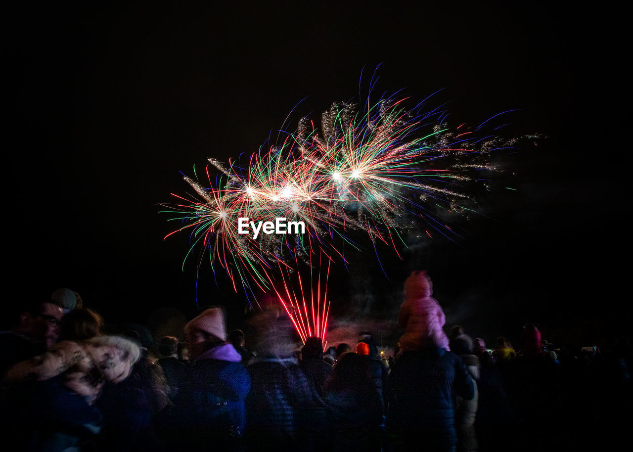 People stood watching the annual bicester round table fireworks spectacular at bicester.