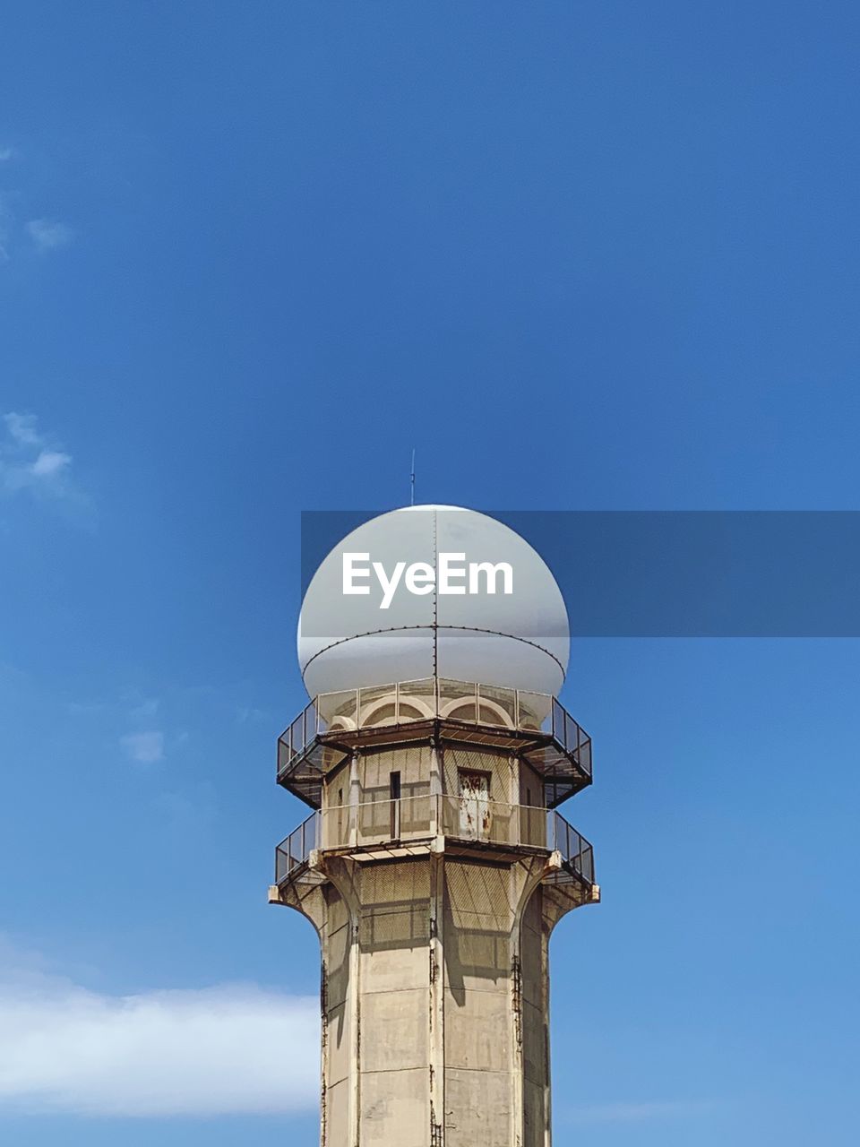 Low angle view of building against clear blue sky