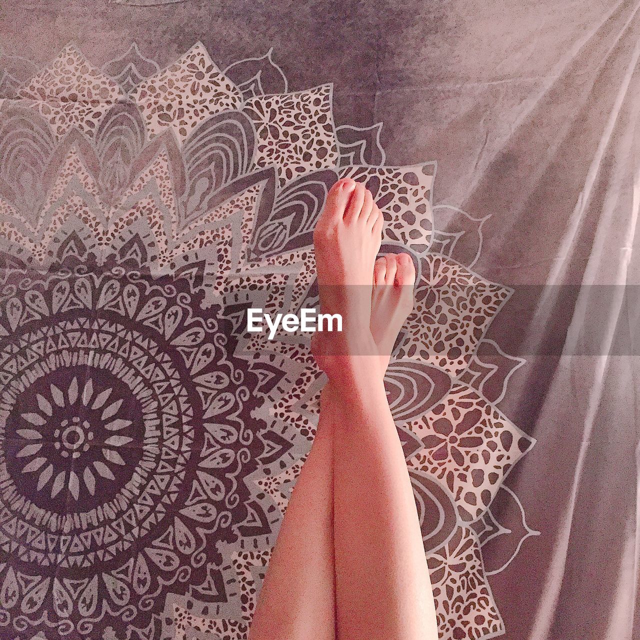 LOW SECTION OF WOMAN LEGS ON FLOOR