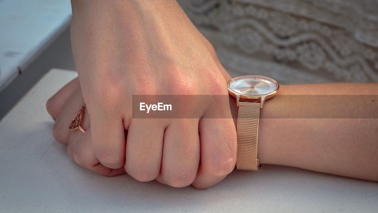 Hand of woman wearing a watch 