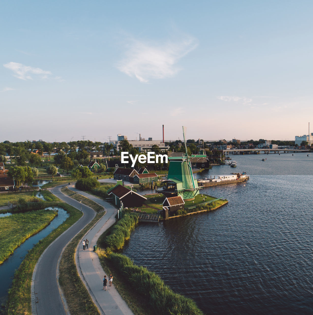 High angle view of river by buildings and road in city