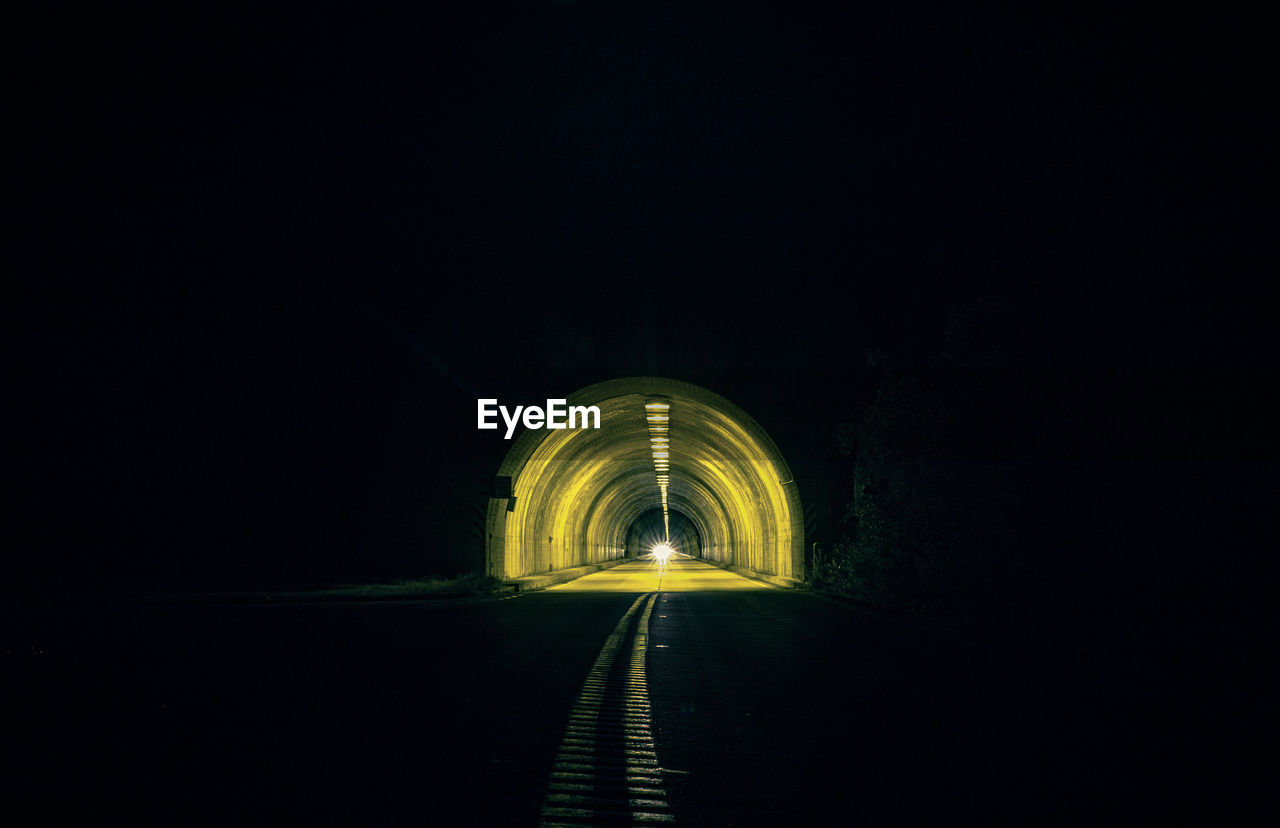 Surface level of empty road in tunnel