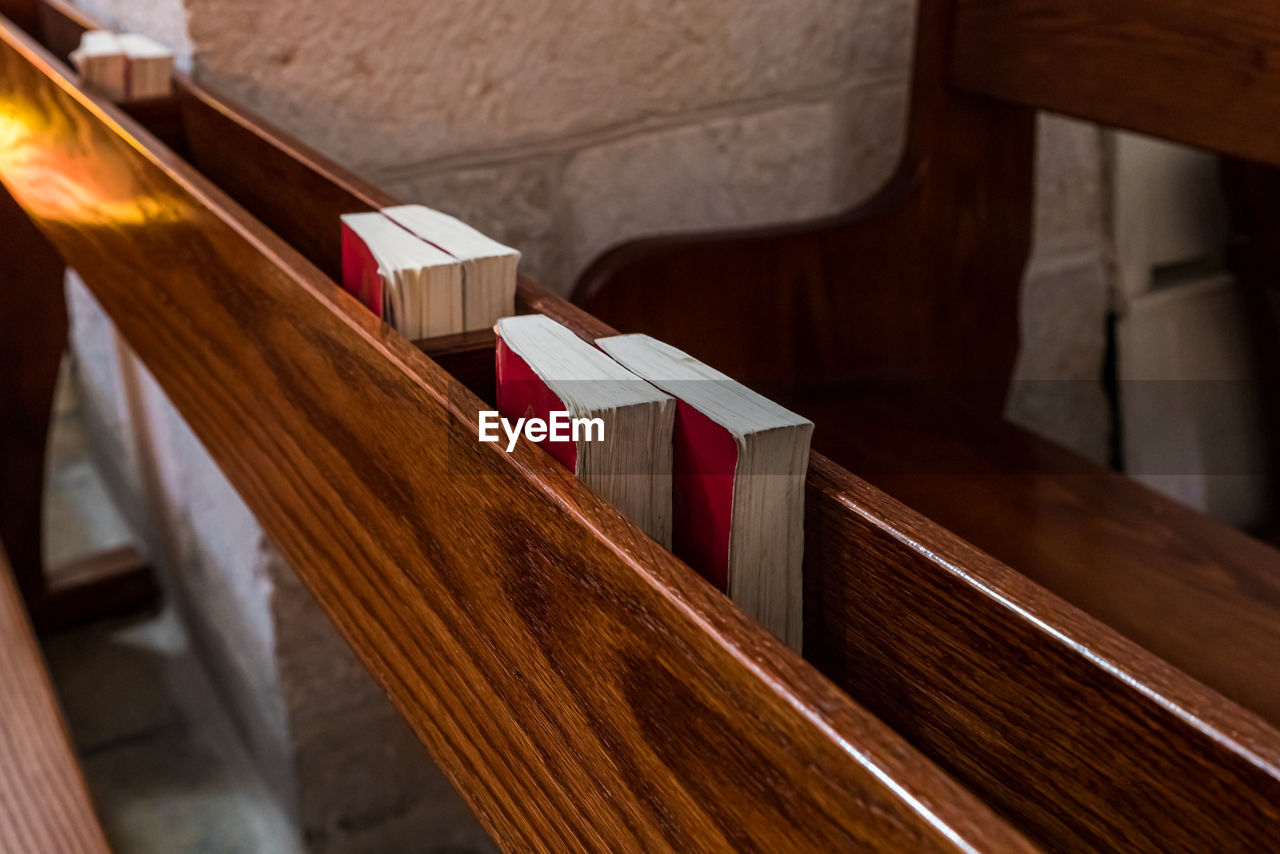 CLOSE-UP OF OPEN BOOK ON TABLE AT TEMPLE