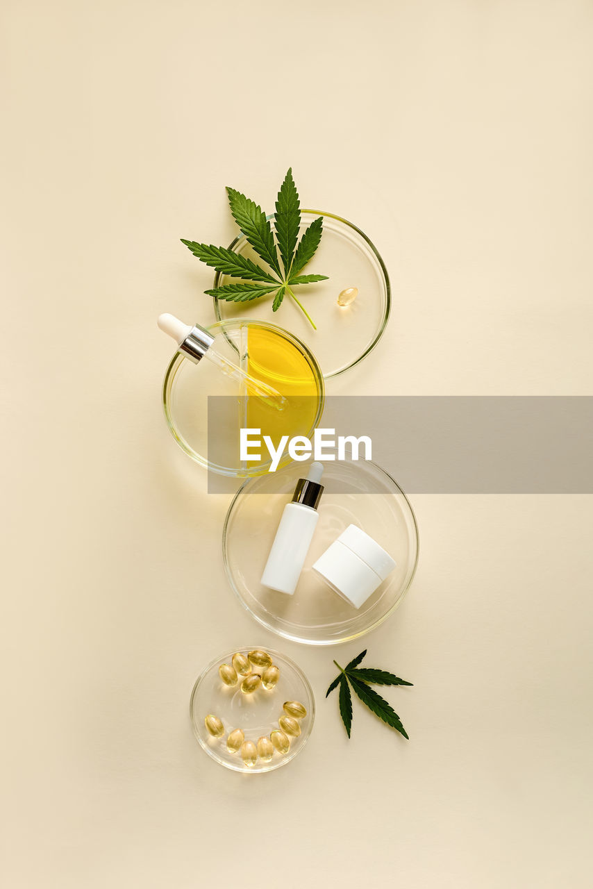 Skin care cosmetics with cbd oil and cannabis in a white mock-up package
