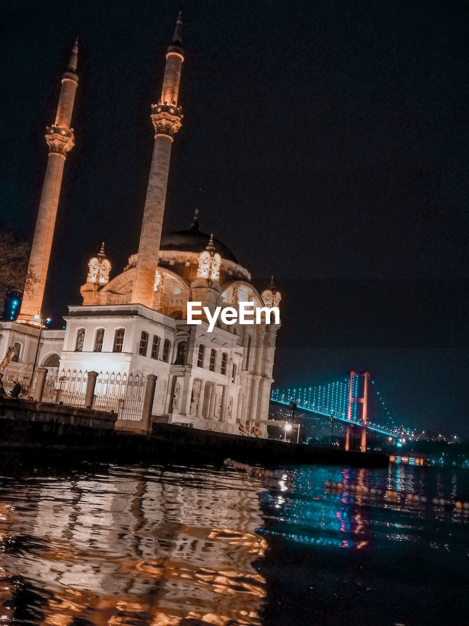 Illuminated buildings in city at night