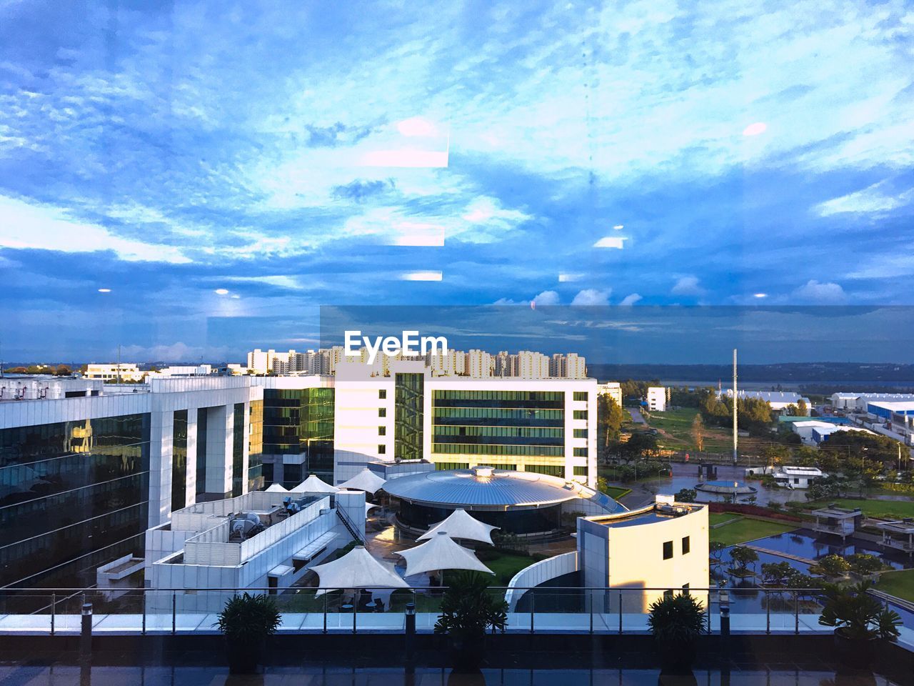 VIEW OF TOWN AGAINST BLUE SKY