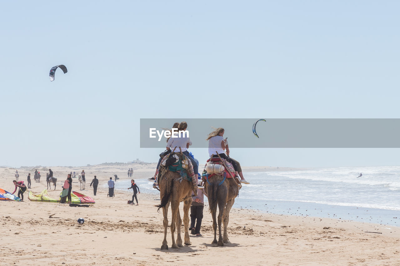 GROUP OF PEOPLE ON BEACH