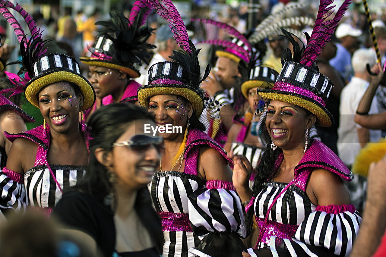 CLOSE-UP OF PEOPLE AT MUSIC FESTIVAL