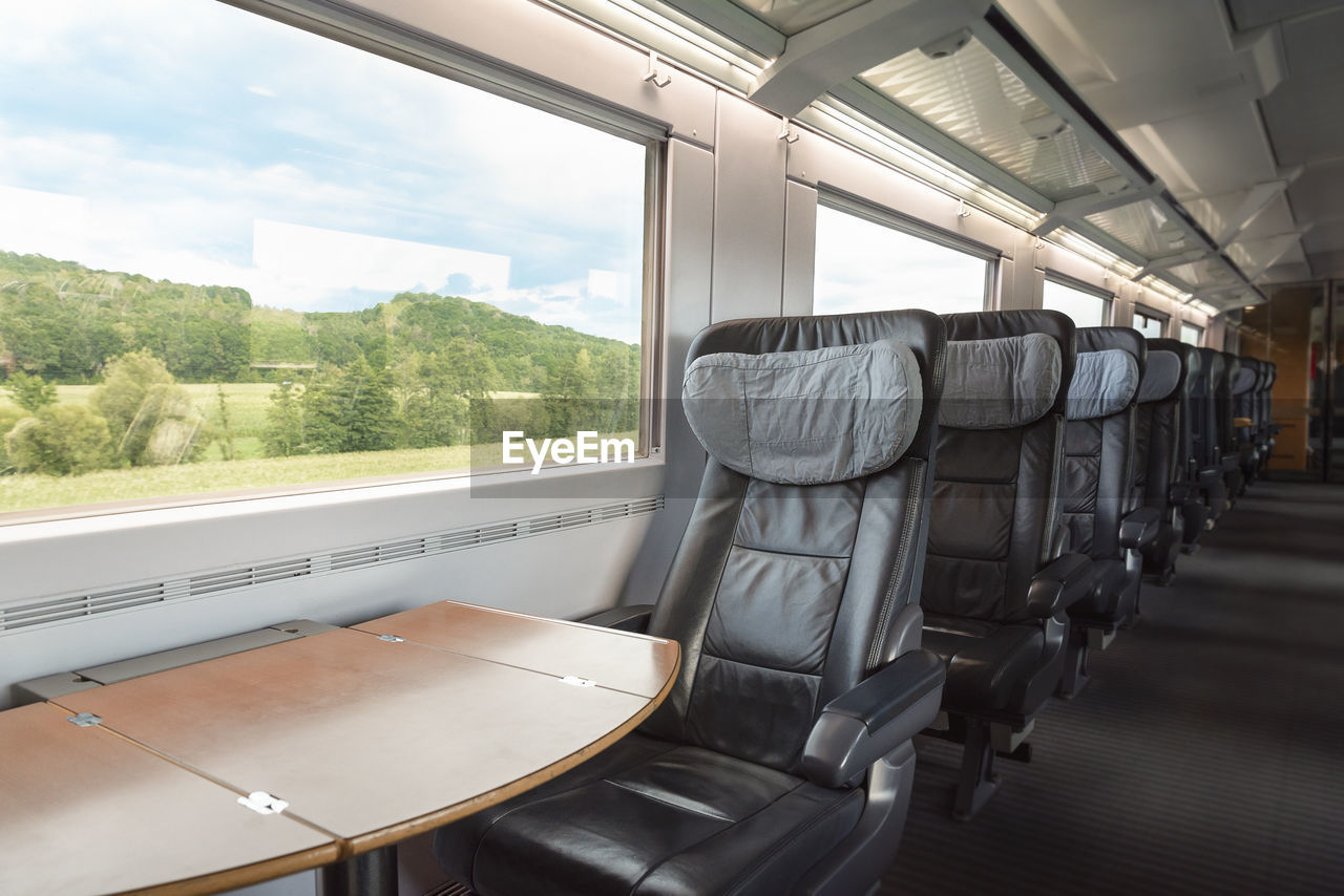 Intercity-express train interior with empty seats, at business class. high-speed german train.