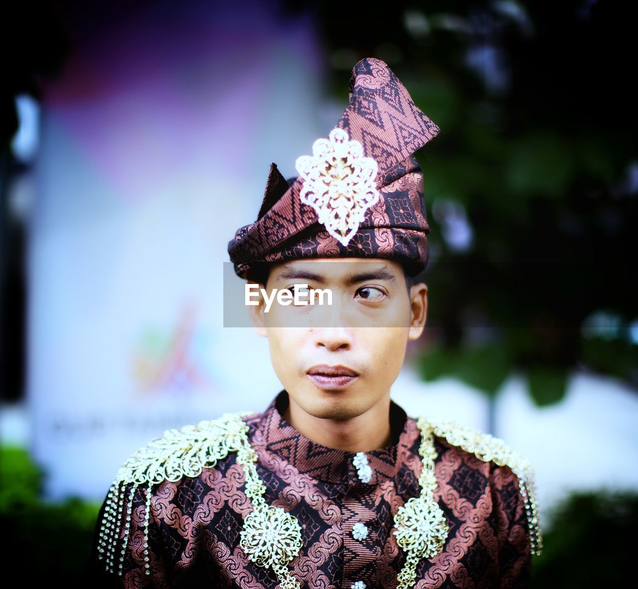 Close-up of man in traditional clothing looking away