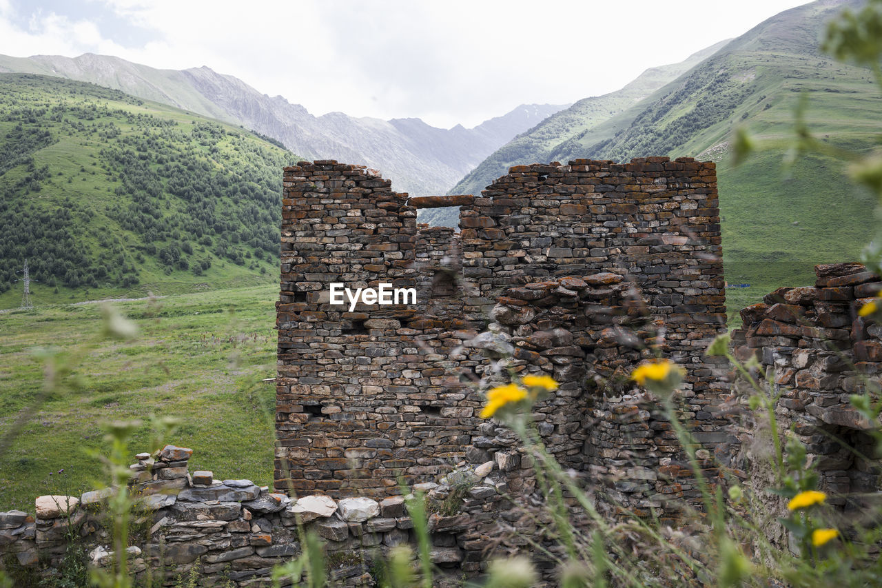 Military and residential ancient towers built of stones. old weathered ruines