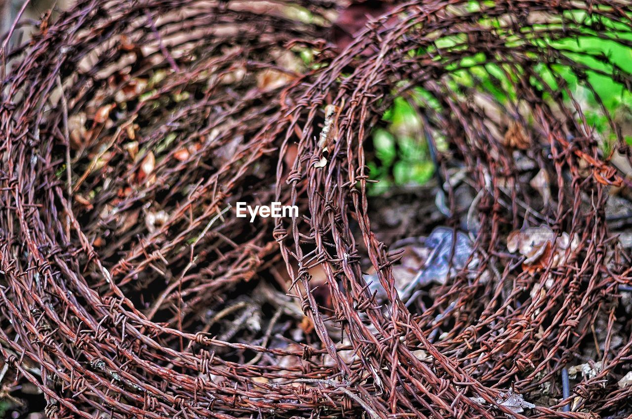 High angle view of barbed wire on field