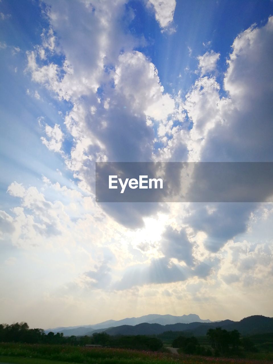 SCENIC VIEW OF CLOUDS OVER LANDSCAPE AGAINST SKY