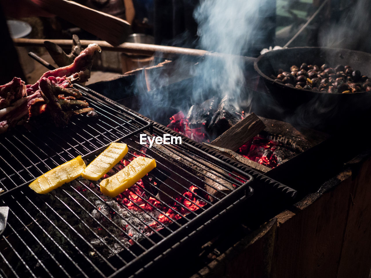 CLOSE-UP OF MEAT ON BARBECUE